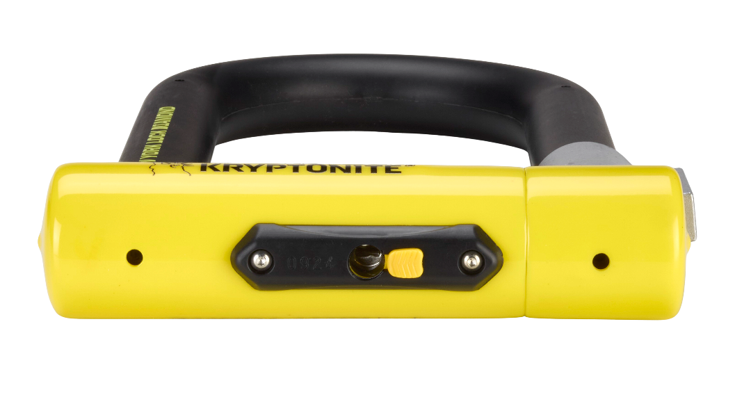 An end view of the Kryptonite New York Diamond lock showing the keyhole and the dust cover for the keyhole.