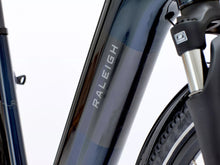 Load image into Gallery viewer, Close-up of an ebike fork with 'Raleigh' branding on a white background.
