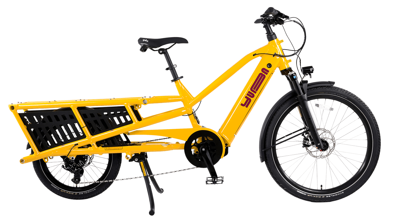 A product image of the Yuba Spicy Curry V4 electric longtail cargo bike. The frame colour is Hello Yellow and the bike is in its basic set up, with no accessories attached.