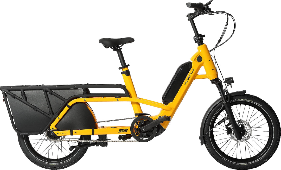A product image of the Velo de Ville Loady electric longtail cargo bike. The frame colour is yellow.