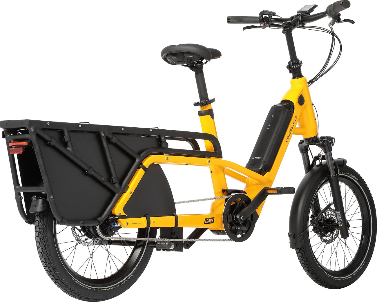 A product image of the Velo de Ville Loady electric longtail cargo bike. The frame colour is yellow. The angle of the photo is from the rear right of the bike.