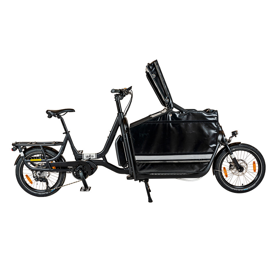 A side view of the Yuba Supercargo electric cargo bike with the professional delivery box attached to the front. The lid of the box is in its open position.