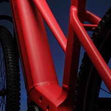Load image into Gallery viewer, A close-up image showing the detail of the red frame colour of a VELO DE VILLE electric bike.