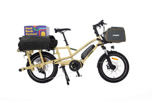 Load image into Gallery viewer, A product image of the Yuba Fastrack electric longtail cargo bike, showing the Latte frame colour option. The DRS bag and Grab and Go bag accessories are attached to the bike.