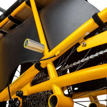 Load image into Gallery viewer, A product image showing the Yuba Kombi Peg foot rest from a lower angle.