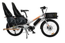 Load image into Gallery viewer, A product image of the Yuba Kombi E5 Electric longtail cargo bike from LeaseBike by Bleeper. The photo shows two child seats attached to the rear rack and a bread basket attached to the front of the bike.