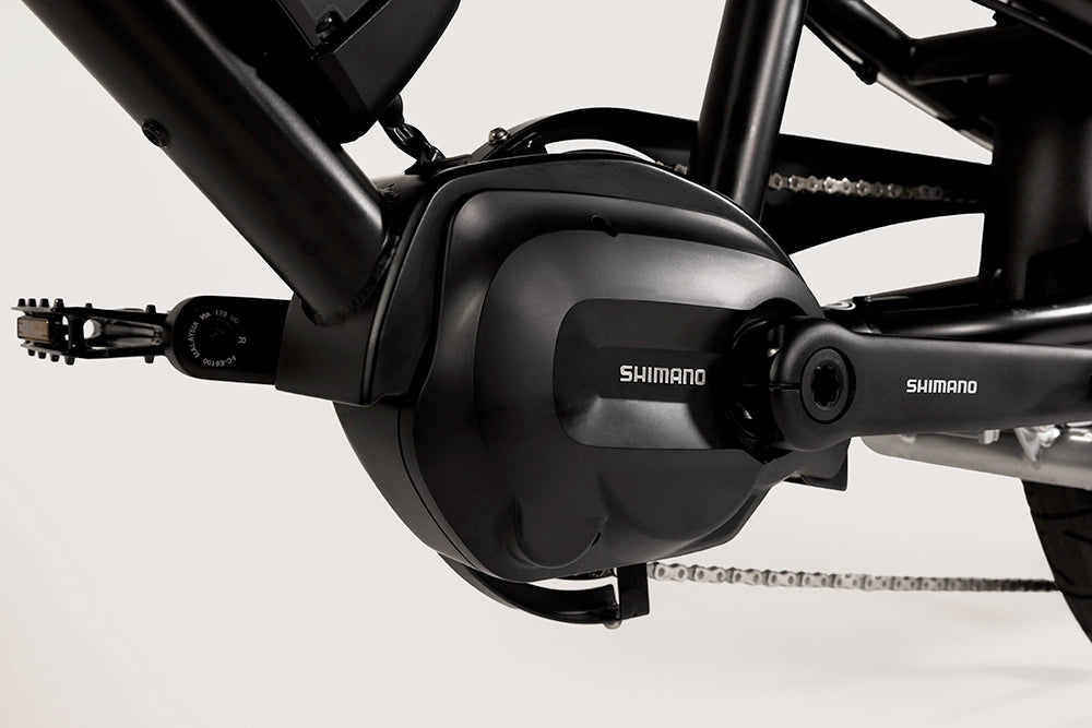 A close-up of the electric motor on the Yuba Kombi E6 electric longtail cargo bike.
