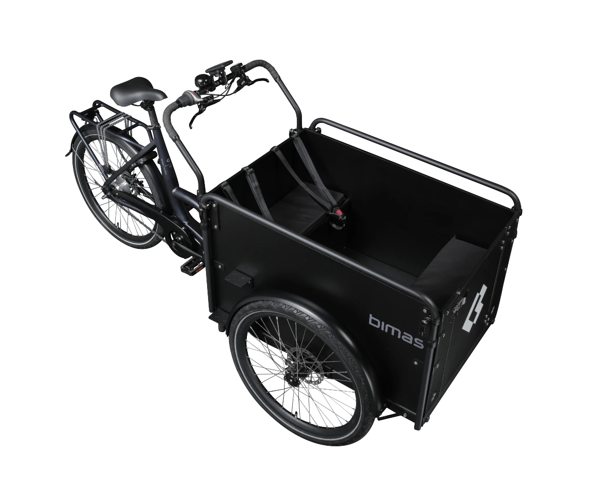 Product image of the Bimas eCargo 3.3 Premium electric cargo bike, shown from the right hand side. The bike frame and cargo box are both black. The photo is taken from an overhead angle showing the interior of the cargo box.