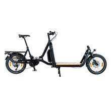 Load image into Gallery viewer, A product image of the Yuba Supercargo CL electric front-loading cargo bike. The model shown has a black frame and a simple timber flatbed on the front end. The bike is available to buy from Bleeper.