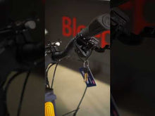 Load and play video in Gallery viewer, A youtube video showing the Yuba Boda Boda electric longtail cargo bike inside the Bleeper showroom in Dublin city centre.