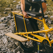 Load image into Gallery viewer, A photo of a Yuba soft spot on the back of a Yuba spicy curry cargo bike.