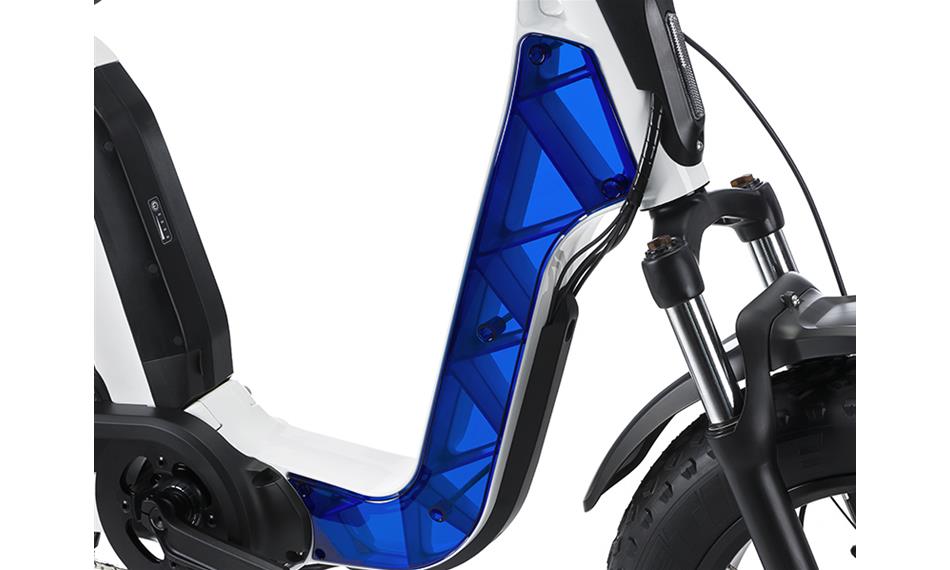 A photo of the Fantic Issimo Urban electric bike showing the white frame with a transparent blue cover. 