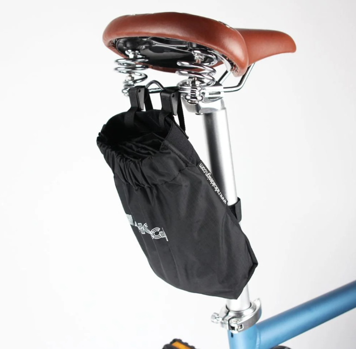 A close-up photo of the saddlebag which carries the Ahooga Transport Cover for the Ahooga folding ebike range. The saddlebag is attached to the seat post and the underside of the Ahooga bike saddle.