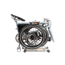 Load image into Gallery viewer, Close-up image of the Ahooga Rear Carrier when it is attached to an Ahooga folding bike which is in its fully folded position.
