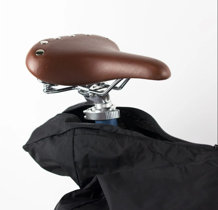 A close-up photo showing the saddle of an Ahooga folding ebike sticking out of the Ahooga Transport Cover.