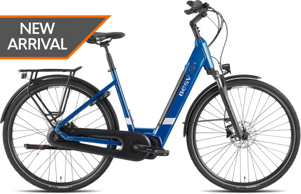 Product image of the BESV CT 2.3 electric bike with the step-through frame variant, in the colour denim blue. A "New Arrival" tag has been overlaid on the image.