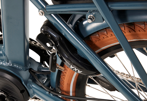 Product image of the Beaufort Billie folding electric bike with a close-up of the Axa wheel lock and key.