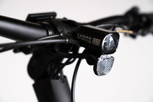 Load image into Gallery viewer, A product image showing a close-up of the Lezyne E115 integrated front light on the BESV CPT 1.4 compact electric bike.
