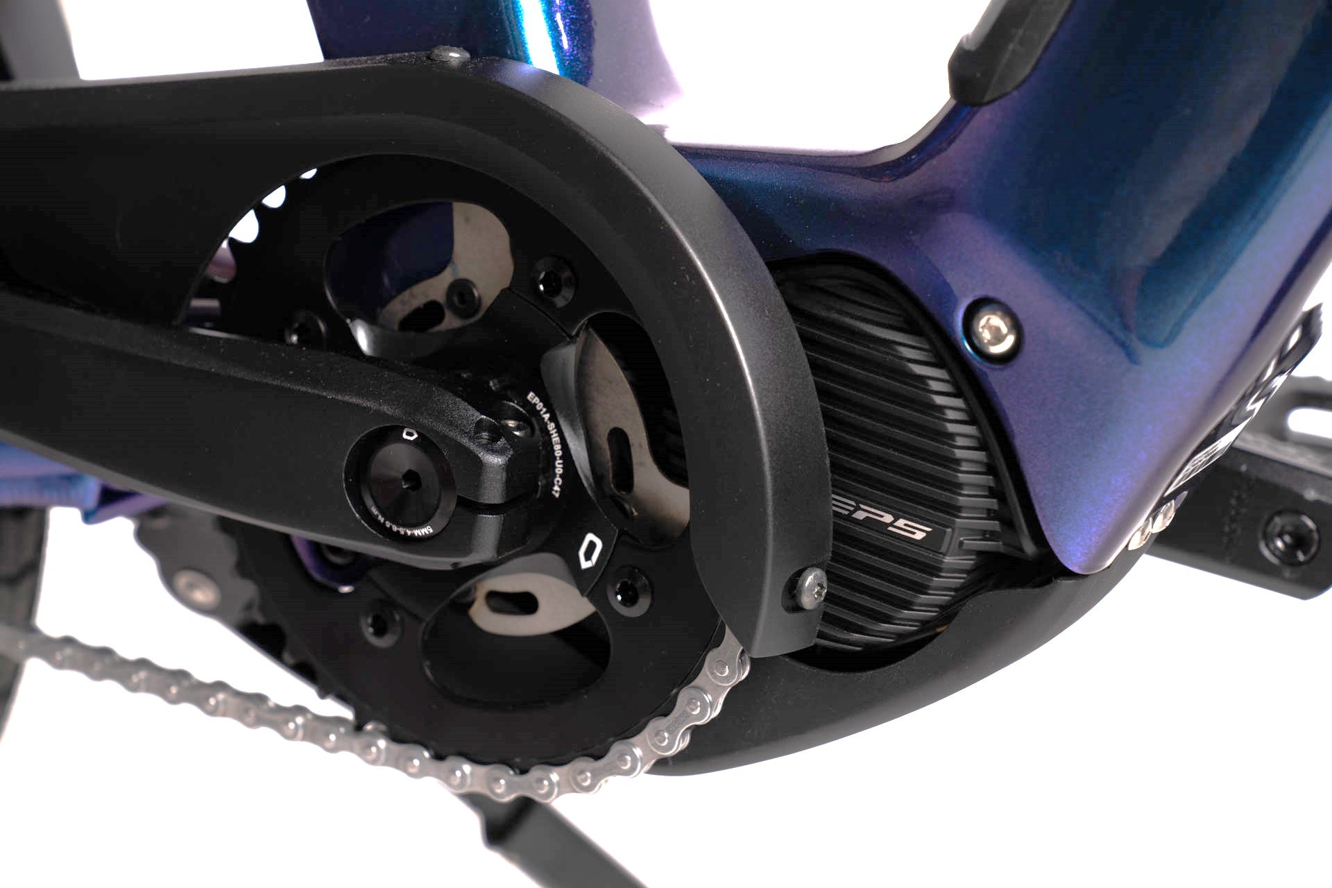 A product image showing a close-up of the chain and electric motor on the BESV CPT 1.4 compact electric bike.