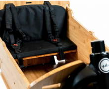 Load image into Gallery viewer, A close-up view of the seat kit for the Yuba Supercargo Bamboo Box add-on.
