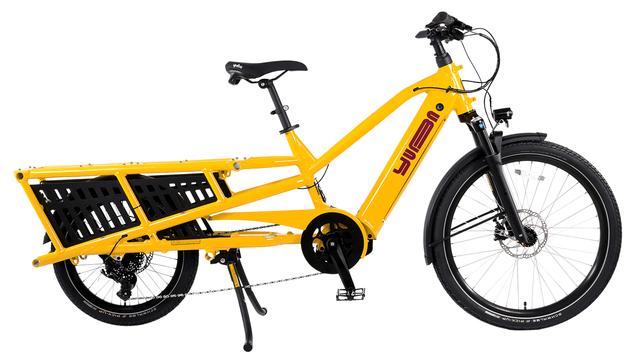 A product image of the Yuba Spicy Curry V4 electric longtail cargo bike. The frame colour is Hello Yellow and the bike is in its basic set up, with no accessories attached. 