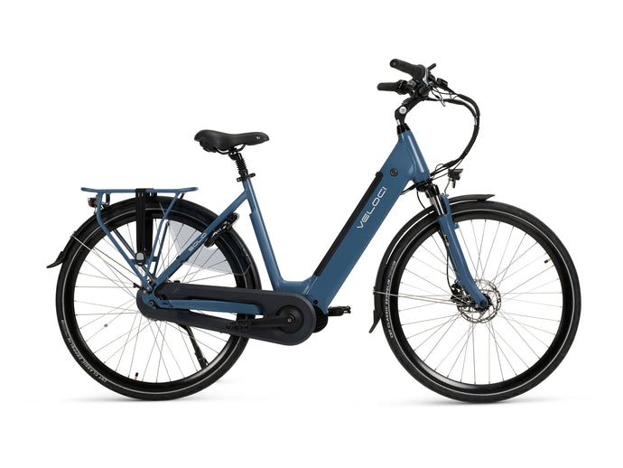 A product image of a Veloci Solid electric bike. The photo is taken straight-on against a white background, displaying all the features on the righthand side of the electric bike. The electric bike has a dark blue frame, the colour is called 