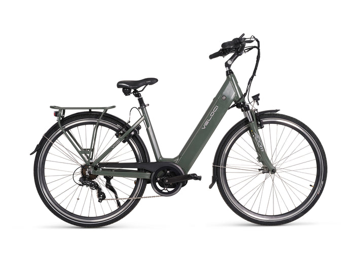 A photo of the right hand side of a Veloci Vivid electric bike against a crisp white studio background. The frame of the bike is a grey/green colour. The thick downtube denotes the integrated battery. The ebike has front fork suspension and the rear derailleur can also be seen. The Veloci Vivid is available for sale from Bleeper, with test rides facilitated at Bleeper's workshop on Merchants Quay in Dublin city centre. 