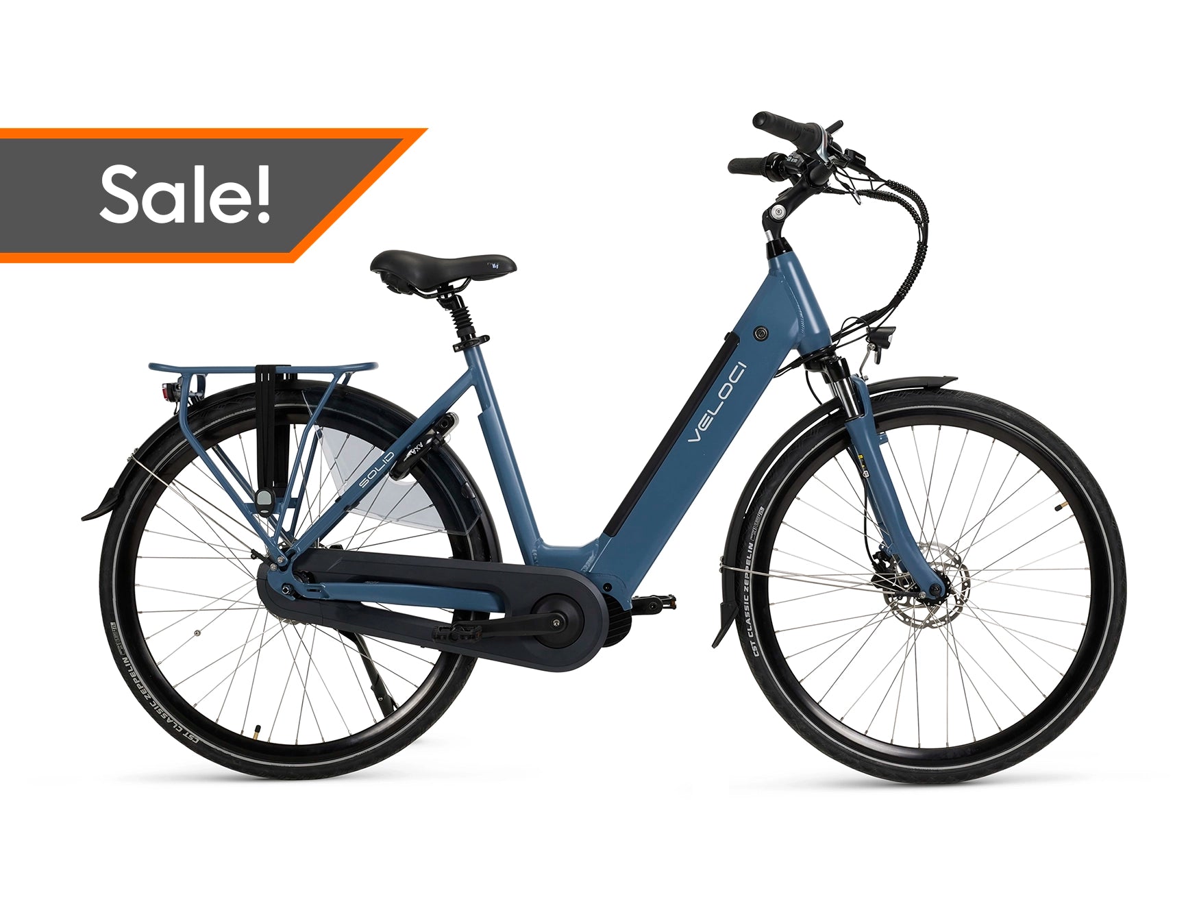 A product image of a Veloci Solid electric bike with a "sale" tag overlaid on it. The photo is taken straight-on against a white background, displaying all the features on the righthand side of the electric bike. The electric bike has a dark blue frame, the colour is called "Eclipse Blue." 