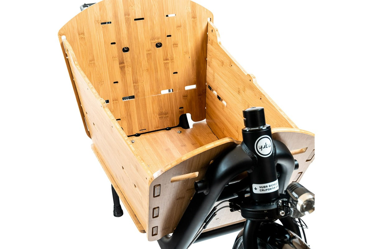 An orthographic photo of the Yuba Bamboo Box accessory fitted to a Yuba Supercargo CL electric cargo bike.