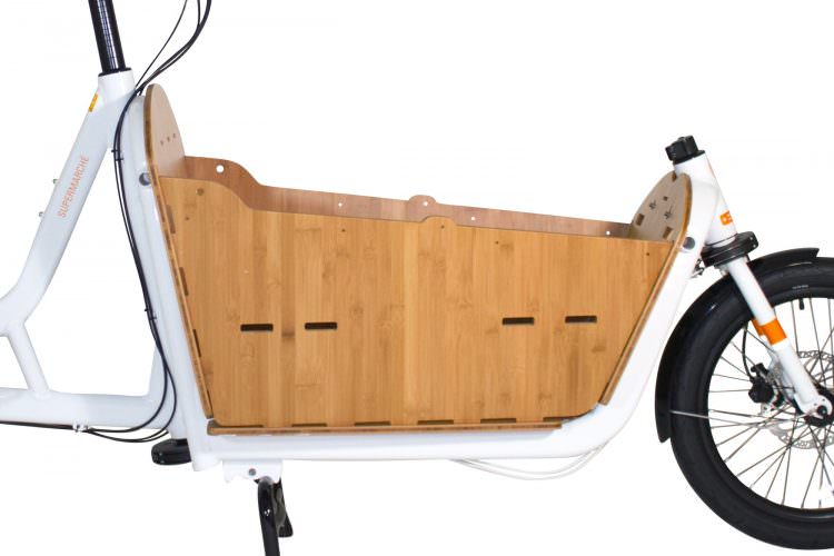 A product image of the Yuba Bamboo Box accessory fitted to a Yuba Supercargo CL electric cargo bike. 