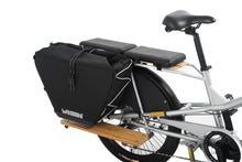 Load image into Gallery viewer, A product image showing the Yuba Eco Baguette bike bag attached to the rear rack of a Yuba Longtail cargo bike. 
