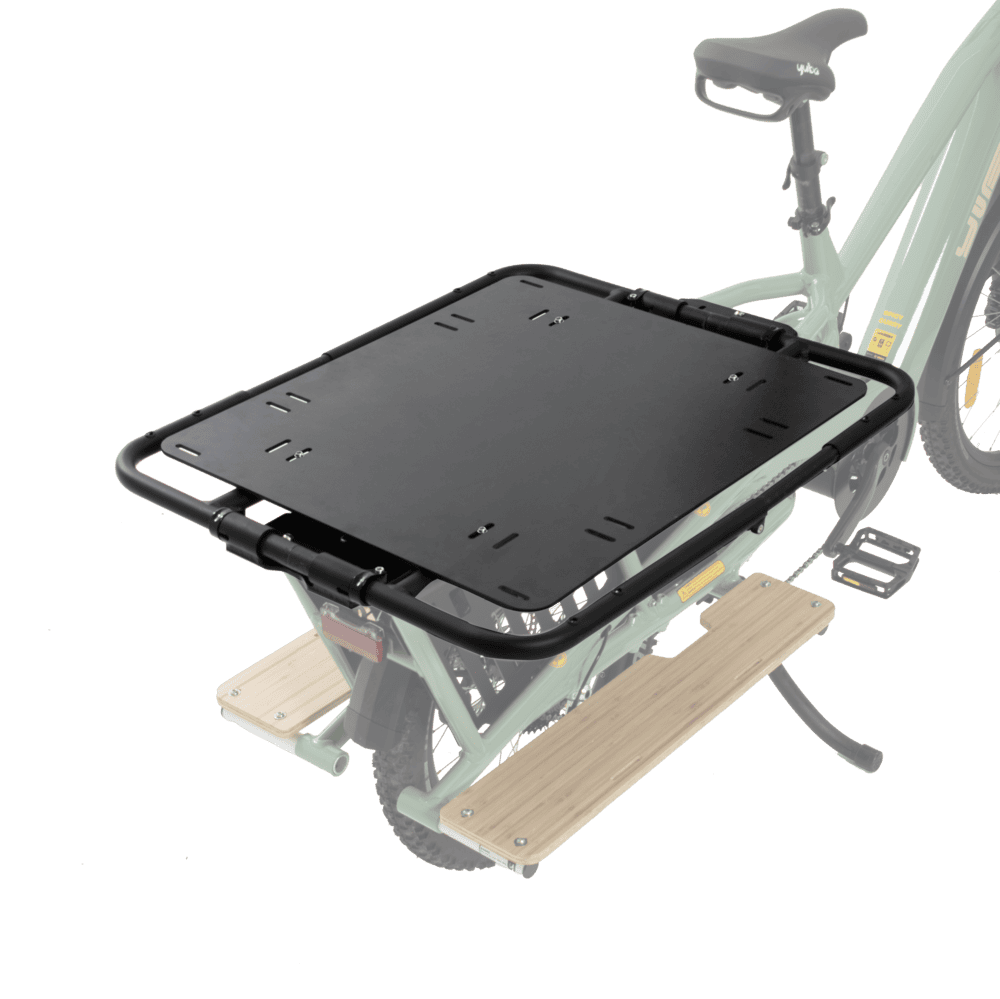 A product image highlighting the black Yuba CarryAll rack on the back of a Yuba Longtail electric cargo bike