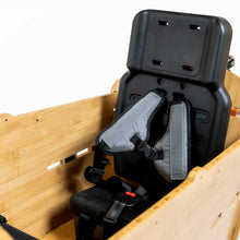 Load image into Gallery viewer, A product image showing the Yuba 2be3 child seat inside the Bamboo Box of the Yuba Supercargo CL electric cargo bike.
