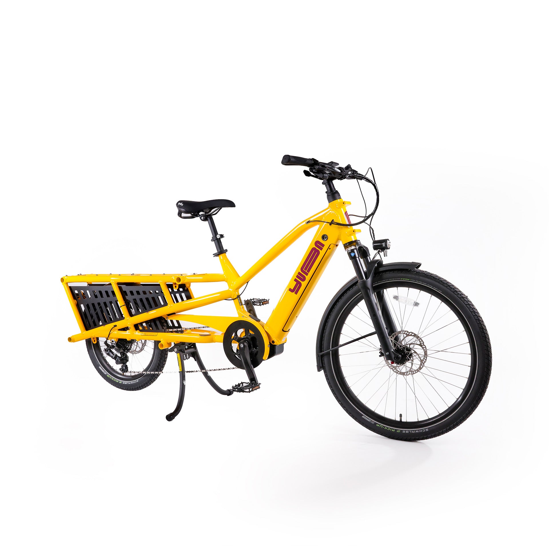 A product image of the Yuba Spicy Curry V4 electric longtail cargo bike taken from an oblique angle. The frame colour is Hello Yellow and the bike is in its basic set up, with no accessories attached. 