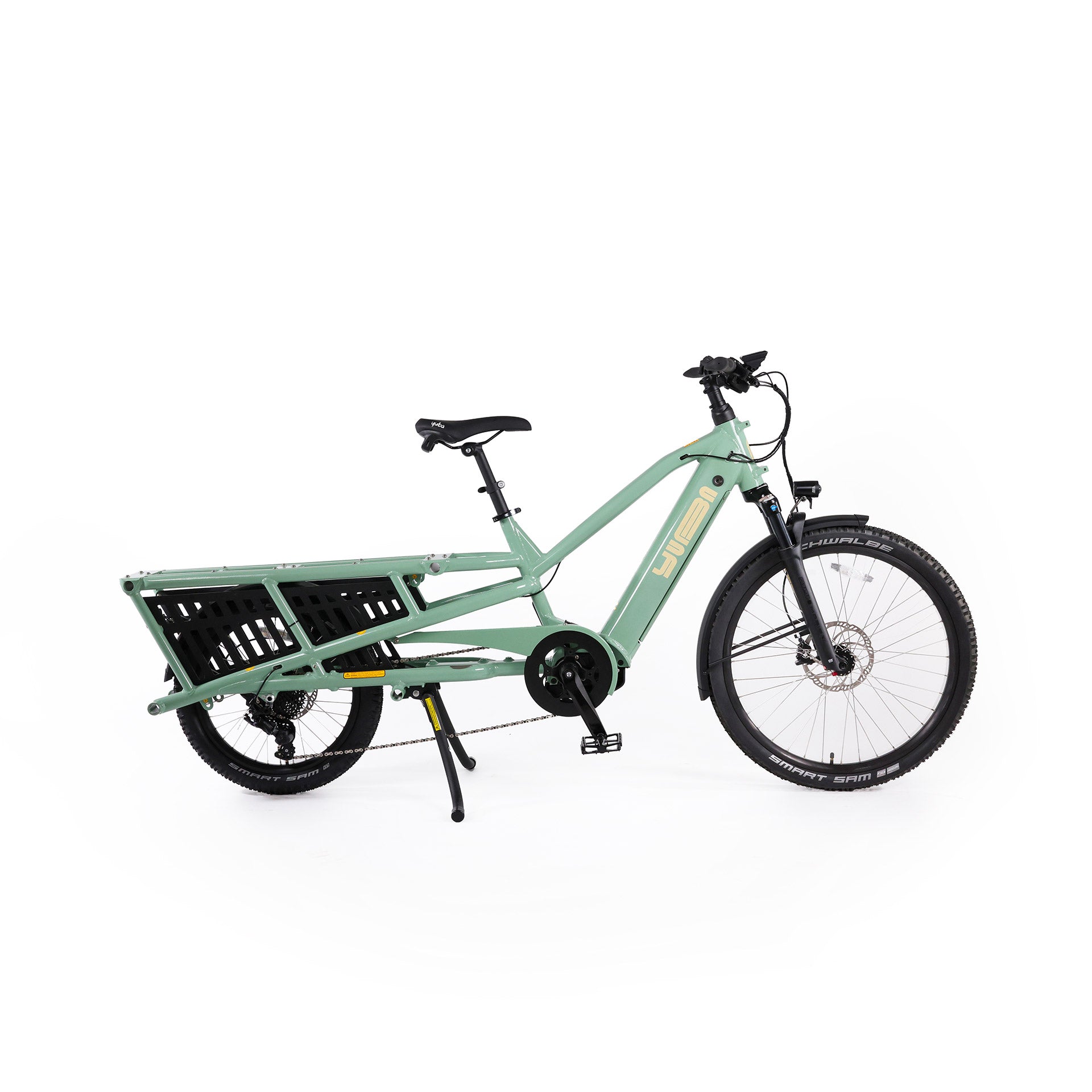 A product image of the Yuba Spicy Curry V4 electric longtail cargo bike. The frame colour is Lunar (a pale green colour) and the bike is in its basic set up, with no accessories attached. 