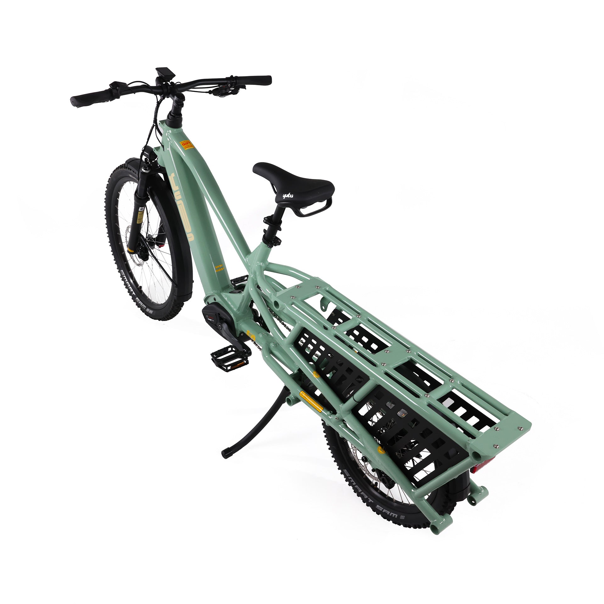 A product image of the Yuba Spicy Curry V4 electric longtail cargo bike. The frame colour is Lunar (a pale green colour) and the bike is in its basic set up, with no accessories attached. 