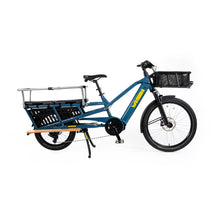 Load image into Gallery viewer, A product image of the Yuba Spicy Curry V4 electric longtail cargo bike. The frame colour is True Blue and the bike has a monkey bar add-on on the rear and a bread basket on the front.
