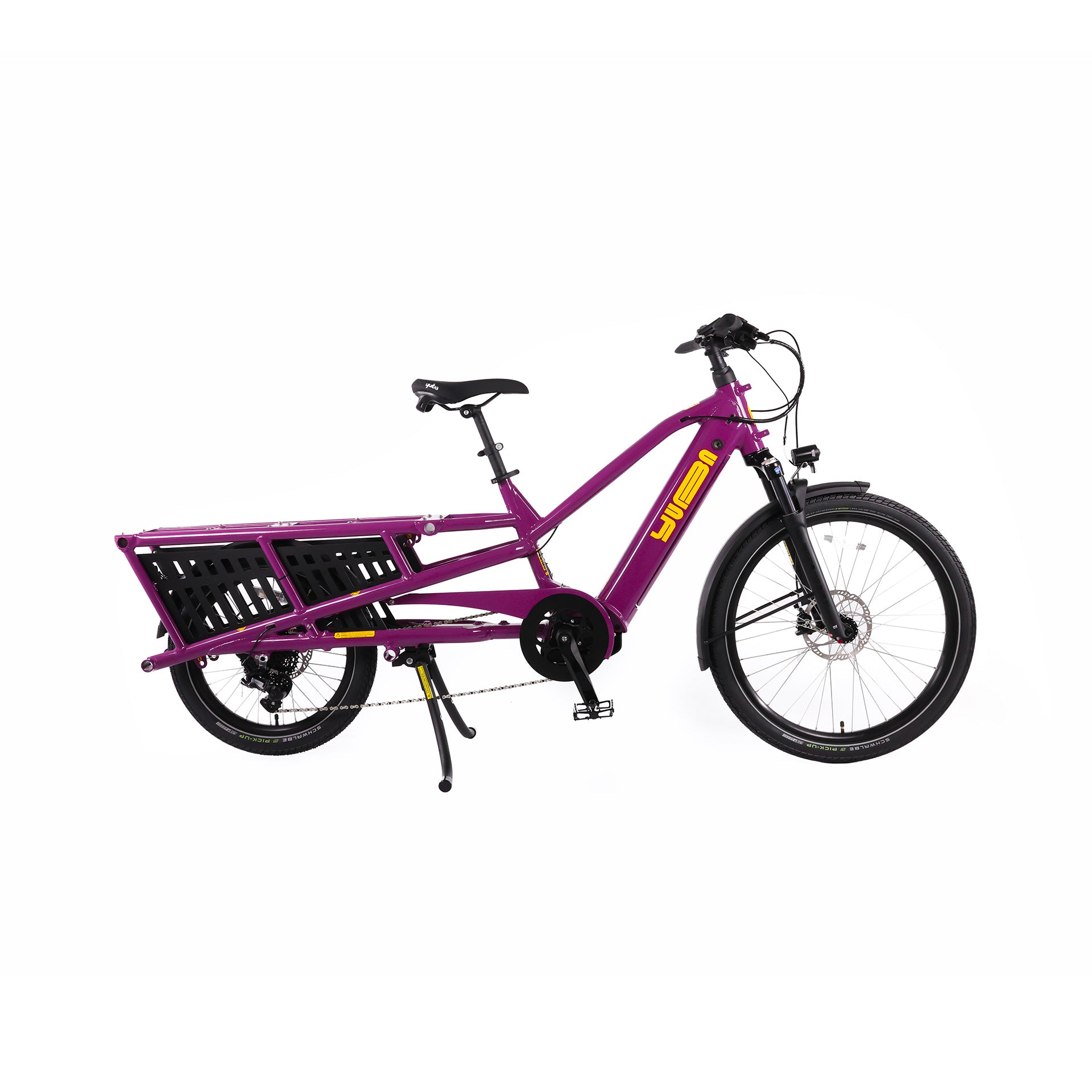 A product image of the Yuba Spicy Curry V4 electric longtail cargo bike. The frame colour is Very Berry (a red grape colour) and the bike is in its basic set up, with no accessories attached. 