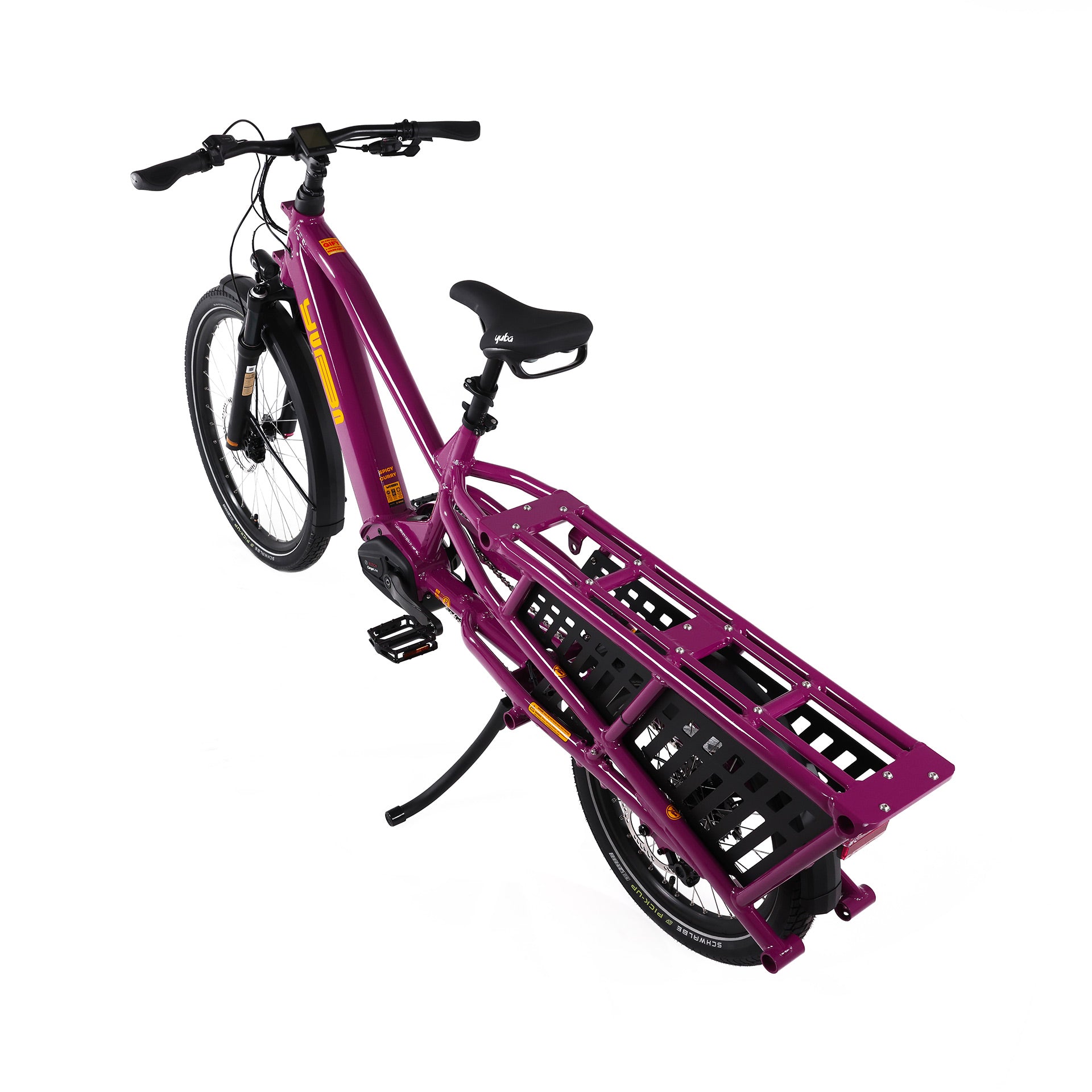 A product image of the Yuba Spicy Curry V4 electric longtail cargo bike taken from an overhead angle. The frame colour is Very Berry (a red grape colour) and the bike is in its basic set up, with no accessories attached. 