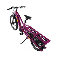 Load image into Gallery viewer, A product image of the Yuba Spicy Curry V4 electric longtail cargo bike taken from an overhead angle. The frame colour is Very Berry (a red grape colour) and the bike is in its basic set up, with no accessories attached. 
