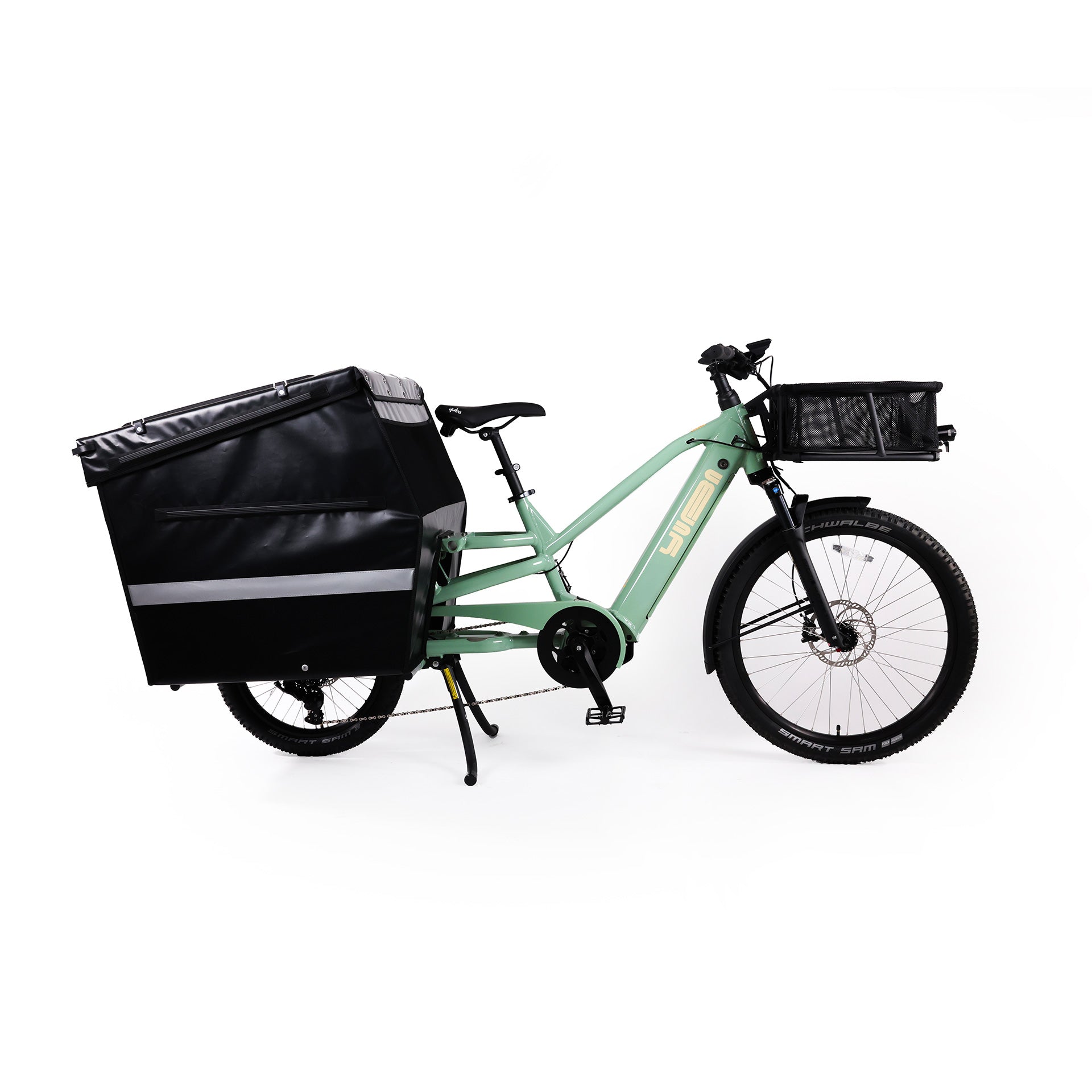 A product image of the Yuba Spicy Curry V4 electric longtail cargo bike. The frame colour is Lunar and the bike is set up with the Professional Box add-on on the rear and a bread basket on the front.