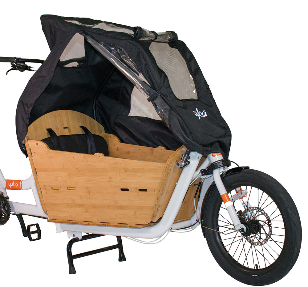 Yuba Supercargo Canopy product image showing the rain tent covering the cargo box on a white Yuba Supercargo CL electric cargo bike. The side door is shown in its rolled up position to allow ventilation and access.