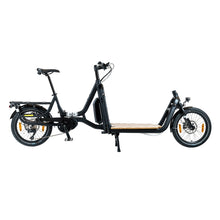 Load image into Gallery viewer, A product image of the Yuba Supercargo CL electric front-loading cargo bike. The model shown has a black frame and a simple timber flatbed on the front end. The bike is available to buy from Bleeper.
