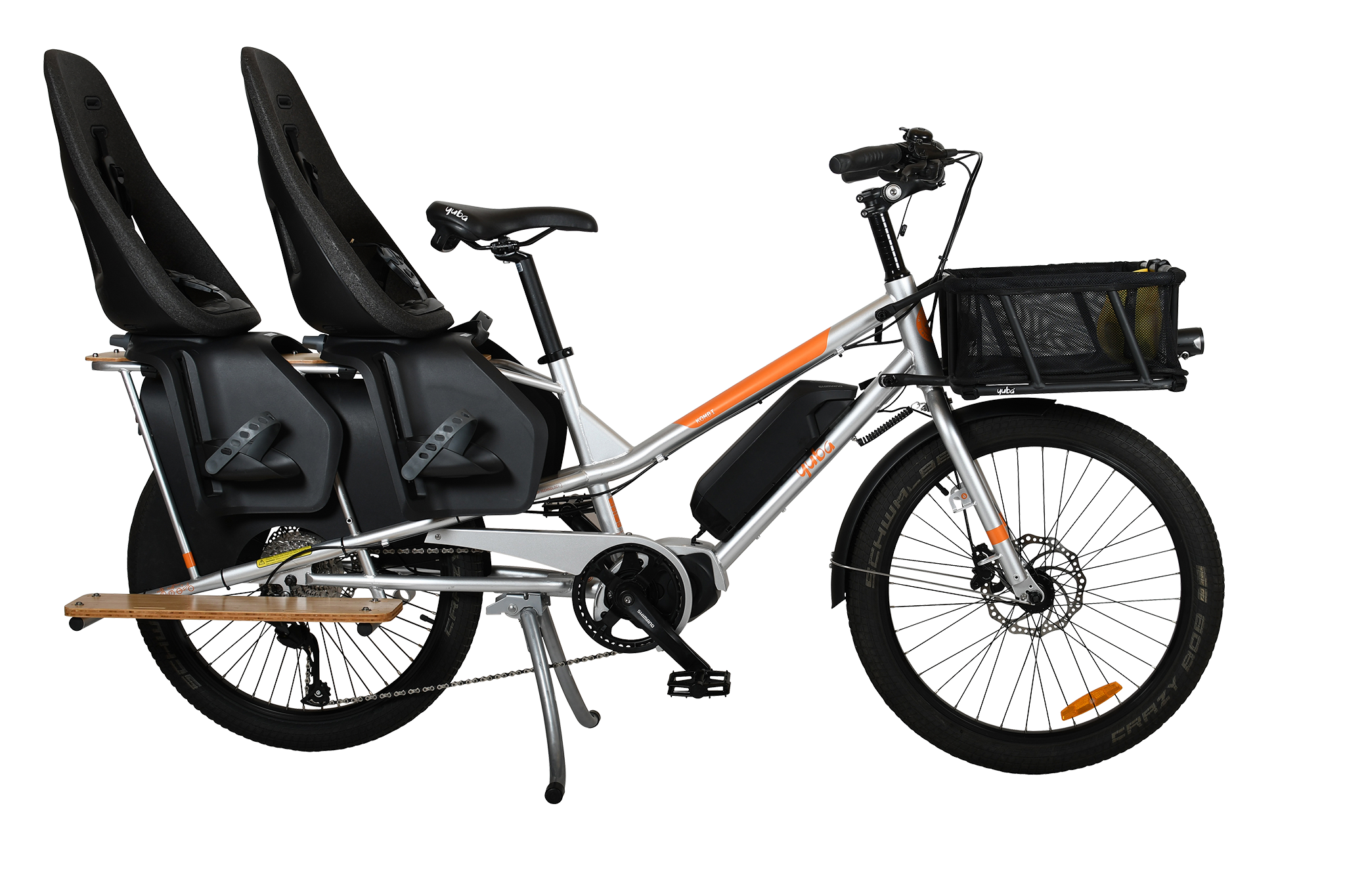 A product image of the Yuba Kombi E5 Electric longtail cargo bike from LeaseBike by Bleeper. The photo shows two child seats attached to the rear rack and a bread basket attached to the front of the bike. 