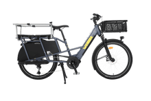 Load image into Gallery viewer, A product image showing the right side of the Yuba Boda Boda electric longtail cargo bike with the Monkey Bars and front basket accessories attached.
