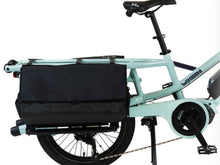 Load image into Gallery viewer, A product picture of the Yuba DRS Bags attached to the rear carrier of the Yuba Fastrack electric longtail cargo bike.
