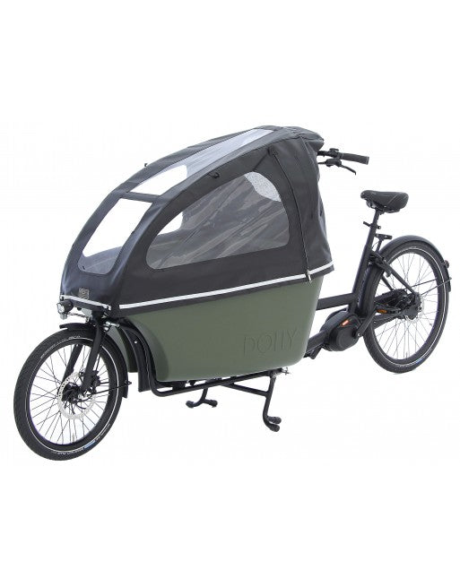 A product image featuring the Dolly electric cargo bike with a rain tent accessory installed. The zippers are closed on the tent in this photo. The photo is taken at an oblique angle.