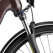 Load image into Gallery viewer, A product image of the BESV TR 1.3 electric bike, showing a close-up of the front fork suspension.
