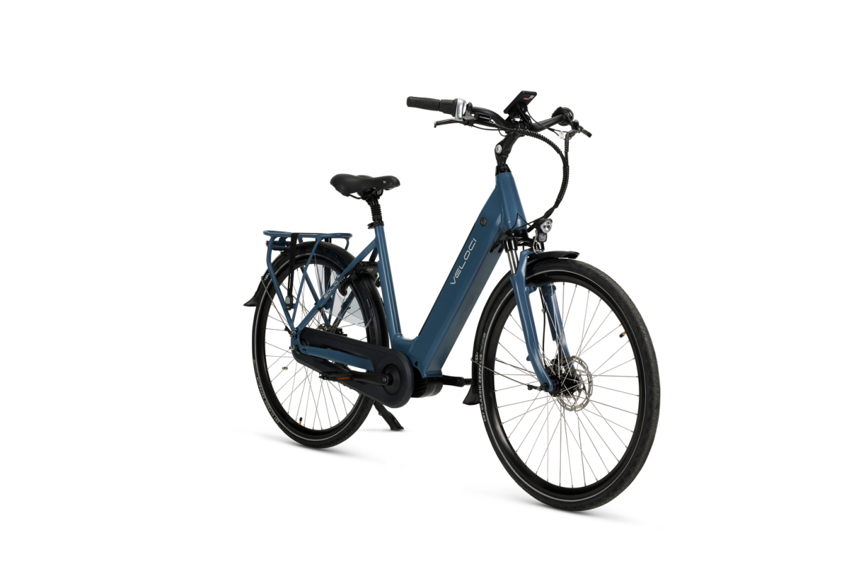 A product image of a Veloci Solid electric bike. The photo is taken at an angle against a white background, displaying all the features on the righthand side of the electric bike. The electric bike has a dark blue frame, the colour is called "Eclipse Blue."