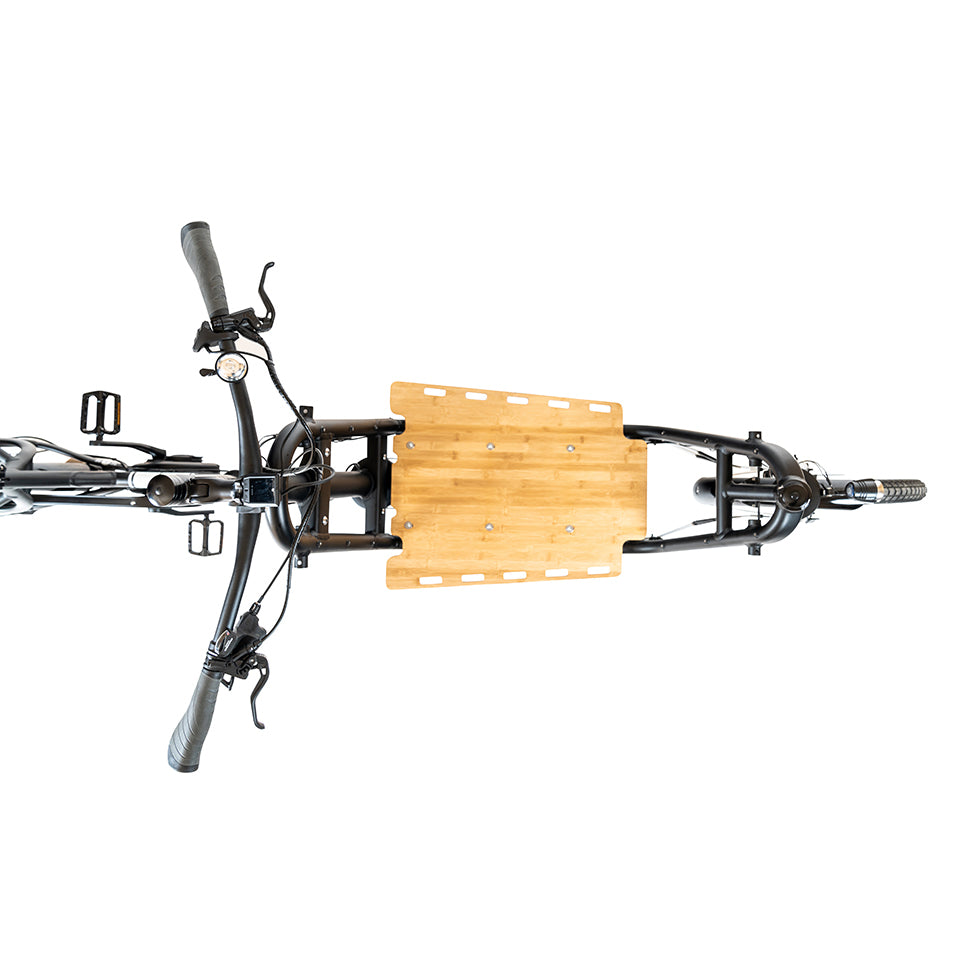 A product image showing an overhead view of the Yuba Supercargo bamboo base board, which attaches to the Yuba Supercargo CL electric cargo bike.